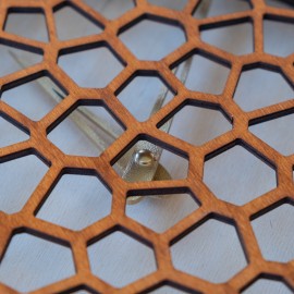 Wooden honeycomb wall clock